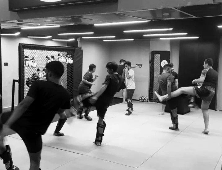 A class practising kicks together